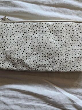 White Coach wristlet handbag with light purple interior